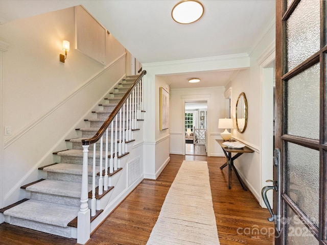 2919 Wickersham Rd, Charlotte, NC 28211 - entryway with dark wood-type flooring, crown molding, stairway, and baseboards
