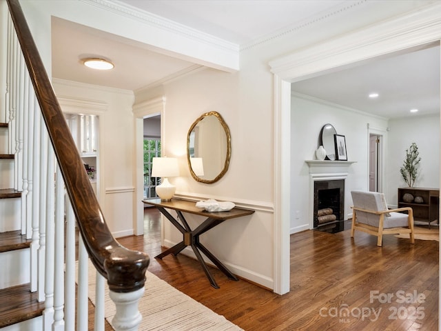 2919 Wickersham Rd, Charlotte, NC 28211 - staircase with wood finished floors, crown molding, a fireplace with flush hearth, baseboards, and recessed lighting