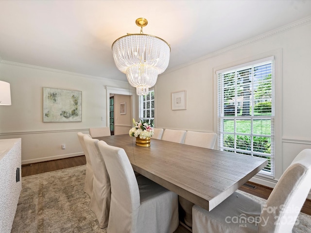 2919 Wickersham Rd, Charlotte, NC 28211 - dining area featuring a chandelier, wood finished floors, and ornamental molding