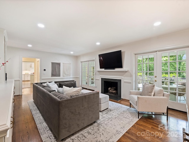 2919 Wickersham Rd, Charlotte, NC 28211 - living area featuring healthy amount of natural light, recessed lighting, wood finished floors, a fireplace, and french doors