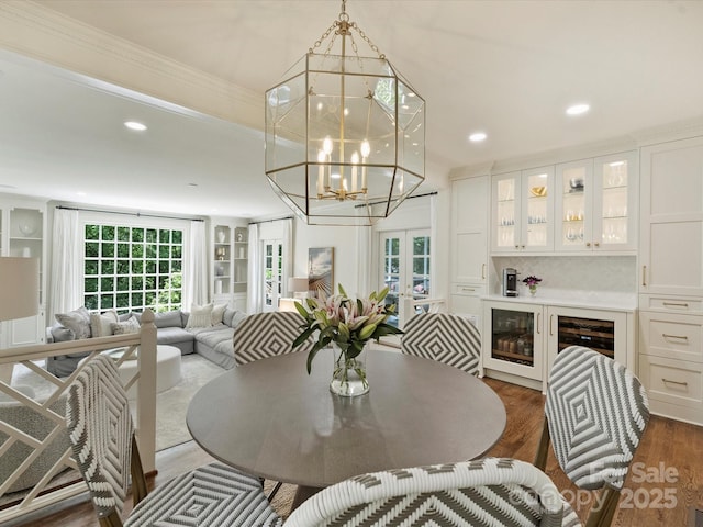 2919 Wickersham Rd, Charlotte, NC 28211 - dining area with dark wood-type flooring, french doors, recessed lighting, beverage cooler, and a chandelier