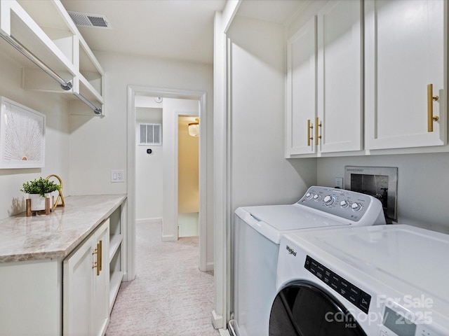 2919 Wickersham Rd, Charlotte, NC 28211 - laundry area with washing machine and dryer, cabinet space, and light carpet