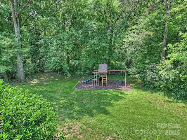 2919 Wickersham Rd, Charlotte, NC 28211 - view of grassy yard featuring a playground and a view of trees