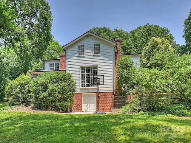 2919 Wickersham Rd, Charlotte, NC 28211 - back of property with brick siding, a chimney, and a yard