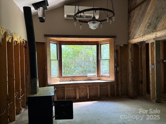 257 River Rd Unit 88, Newland, NC 28657 - unfurnished office featuring high vaulted ceiling and a wood stove