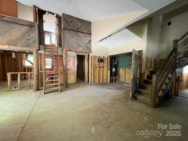 257 River Rd Unit 88, Newland, NC 28657 - unfurnished living room featuring stairs and high vaulted ceiling