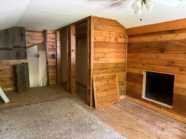 257 River Rd Unit 88, Newland, NC 28657 - additional living space featuring lofted ceiling, ceiling fan, wood finished floors, and wood walls