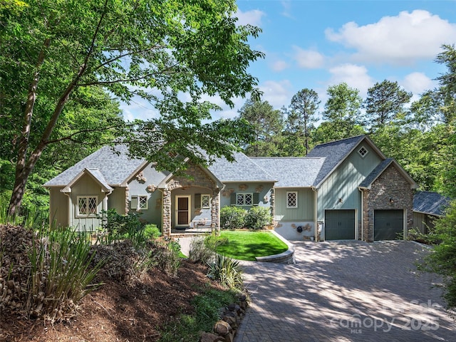 92 Island View Ct, Mill Spring, NC 28756 - view of front of property with stone siding, roof with shingles, and decorative driveway