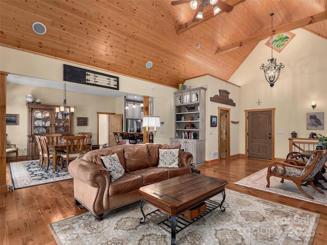 92 Island View Ct, Mill Spring, NC 28756 - living area with a chandelier, high vaulted ceiling, light wood-style flooring, ceiling fan, and wood ceiling with exposed beams