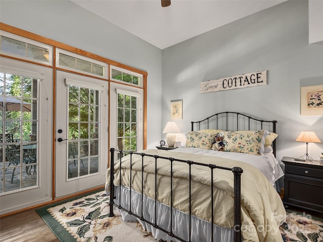 92 Island View Ct, Mill Spring, NC 28756 - bedroom featuring access to outside, multiple windows, wood finished floors, and a ceiling fan