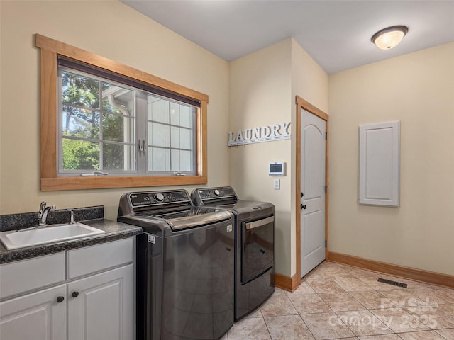 92 Island View Ct, Mill Spring, NC 28756 - washroom with separate washer and dryer, cabinet space, baseboards, and light tile patterned floors