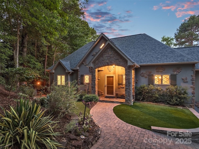 92 Island View Ct, Mill Spring, NC 28756 - view of front of property featuring stone siding, stucco siding, a front yard, and roof with shingles