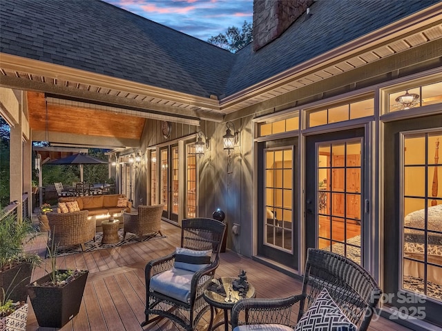92 Island View Ct, Mill Spring, NC 28756 - deck at dusk featuring an outdoor living space and outdoor dining area