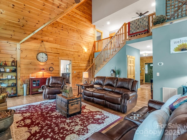 287 Matho Trce, Lake Lure, NC 28746 - living area with a towering ceiling, wooden walls, wood finished floors, and stairs