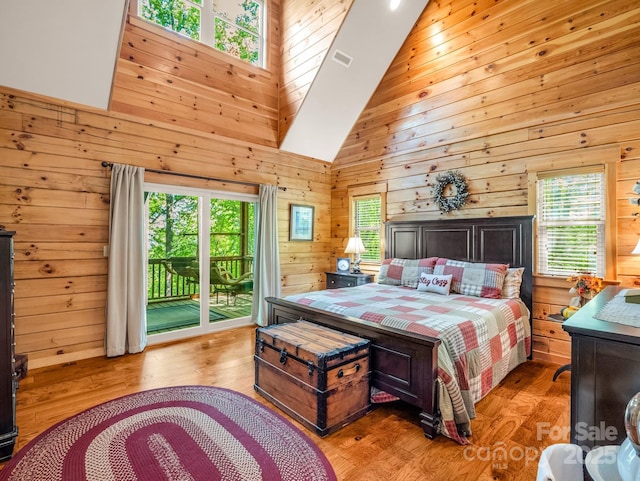 287 Matho Trce, Lake Lure, NC 28746 - bedroom featuring access to outside, wood walls, light wood-type flooring, and high vaulted ceiling