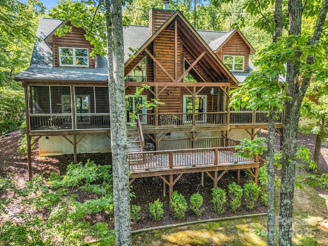 287 Matho Trce, Lake Lure, NC 28746 - back of property featuring a shingled roof, a deck, a chimney, and log siding