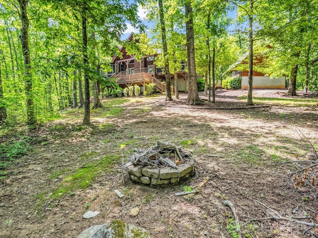 287 Matho Trce, Lake Lure, NC 28746 - view of yard featuring stairs, a fire pit, and a wooden deck