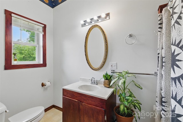 33 Faholoa Ridge Rd, Black Mountain, NC 28711 - bathroom with toilet, vanity, and baseboards