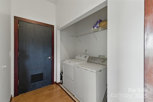 33 Faholoa Ridge Rd, Black Mountain, NC 28711 - laundry room featuring washer and dryer and light wood-type flooring