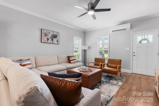 1067 33rd Avenue Loop NE, Hickory, NC 28601 - living room with a wall unit AC, ornamental molding, ceiling fan, wood finished floors, and baseboards