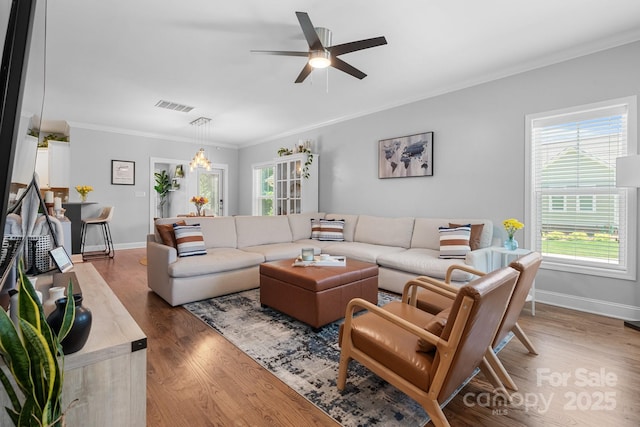 1067 33rd Avenue Loop NE, Hickory, NC 28601 - living area featuring ornamental molding, wood finished floors, a ceiling fan, and baseboards