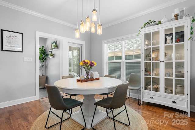 1067 33rd Avenue Loop NE, Hickory, NC 28601 - dining area featuring crown molding, wood finished floors, baseboards, and a chandelier