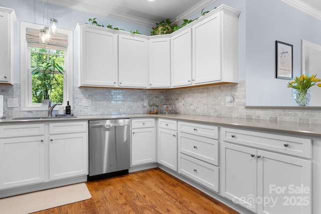 1067 33rd Avenue Loop NE, Hickory, NC 28601 - kitchen featuring stainless steel dishwasher, a sink, crown molding, light wood-type flooring, and white cabinetry