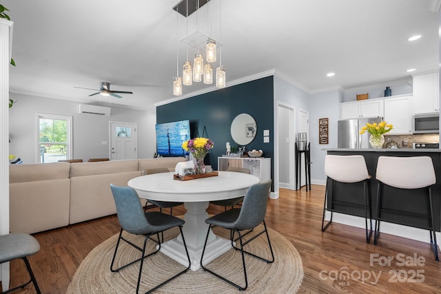 1067 33rd Avenue Loop NE, Hickory, NC 28601 - dining area featuring a wall mounted AC, crown molding, wood finished floors, a ceiling fan, and recessed lighting
