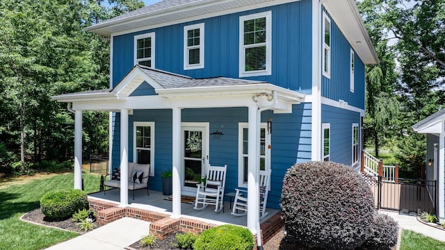 1067 33rd Avenue Loop NE, Hickory, NC 28601 - view of front of home with covered porch, board and batten siding, and a shingled roof