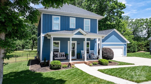 1067 33rd Avenue Loop NE, Hickory, NC 28601 - traditional style home with covered porch, board and batten siding, driveway, and roof with shingles