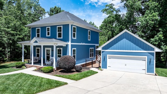 1067 33rd Avenue Loop NE, Hickory, NC 28601 - view of front of house with a porch, an outbuilding, a front yard, and a shingled roof