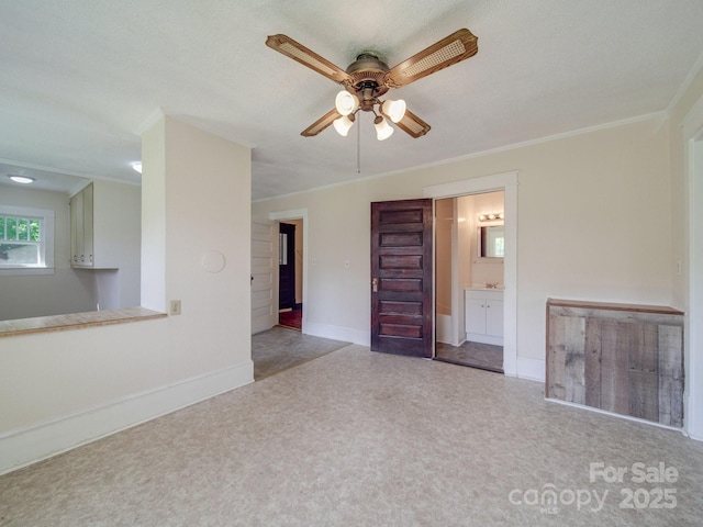 435 W Whitley St, Norwood, NC 28128 - unfurnished living room featuring ceiling fan, baseboards, and ornamental molding