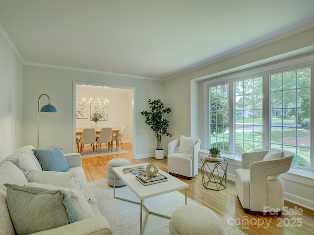 6116 Springhouse Ln, Charlotte, NC 28211 - living area featuring a chandelier, crown molding, and wood finished floors