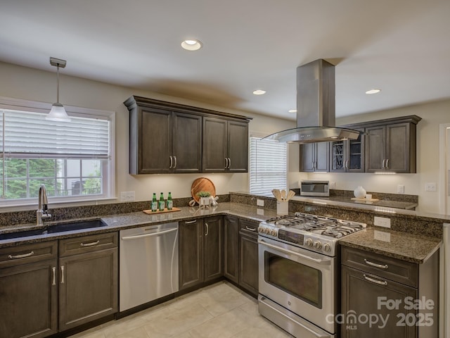 6116 Springhouse Ln, Charlotte, NC 28211 - kitchen with appliances with stainless steel finishes, island range hood, dark brown cabinets, dark stone countertops, and recessed lighting