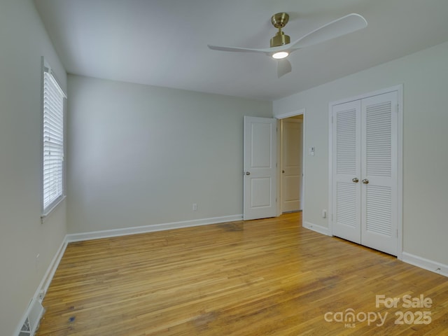 6116 Springhouse Ln, Charlotte, NC 28211 - unfurnished bedroom featuring light wood-style flooring, a closet, and a ceiling fan