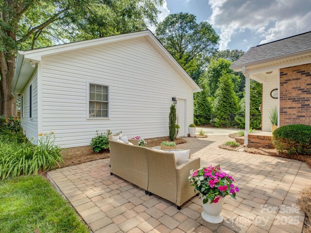 6116 Springhouse Ln, Charlotte, NC 28211 - view of patio featuring an attached garage