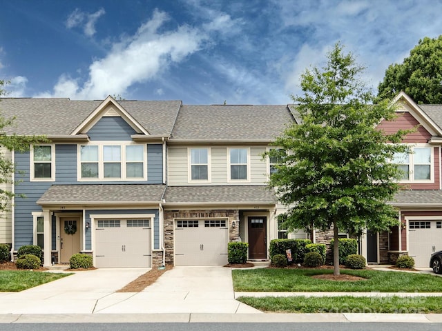 403 Park Meadows Dr, Matthews, NC 28104 - view of front facade with concrete driveway, an attached garage, a shingled roof, and stone siding