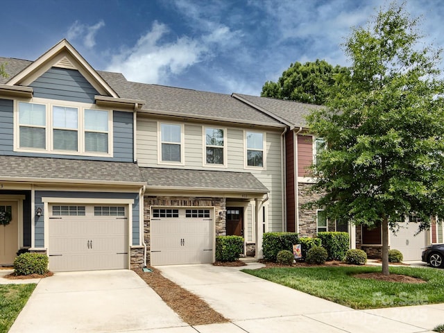 403 Park Meadows Dr, Matthews, NC 28104 - view of property featuring concrete driveway, stone siding, roof with shingles, and a garage