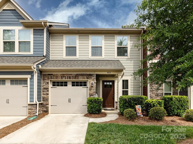 403 Park Meadows Dr, Matthews, NC 28104 - multi unit property with a garage, driveway, stone siding, and a shingled roof