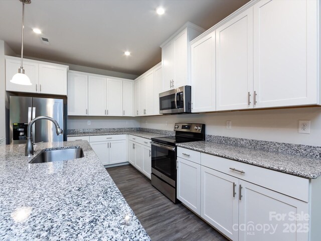403 Park Meadows Dr, Matthews, NC 28104 - kitchen featuring appliances with stainless steel finishes, a sink, recessed lighting, white cabinets, and decorative light fixtures