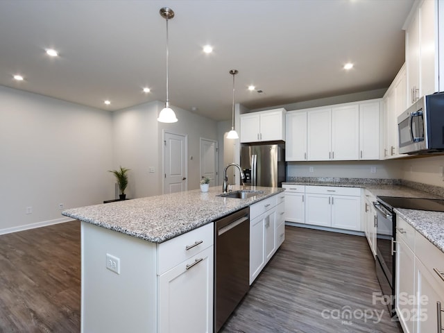 403 Park Meadows Dr, Matthews, NC 28104 - kitchen featuring stainless steel appliances, a sink, a center island with sink, dark wood-style flooring, and recessed lighting