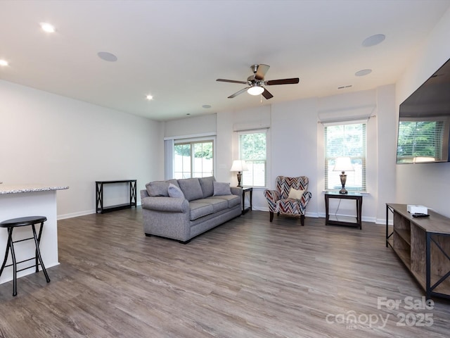 403 Park Meadows Dr, Matthews, NC 28104 - living room featuring wood finished floors, plenty of natural light, ceiling fan, baseboards, and recessed lighting