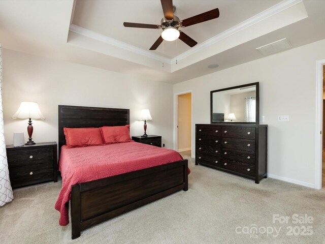 403 Park Meadows Dr, Matthews, NC 28104 - bedroom with crown molding, a raised ceiling, carpet, a ceiling fan, and baseboards