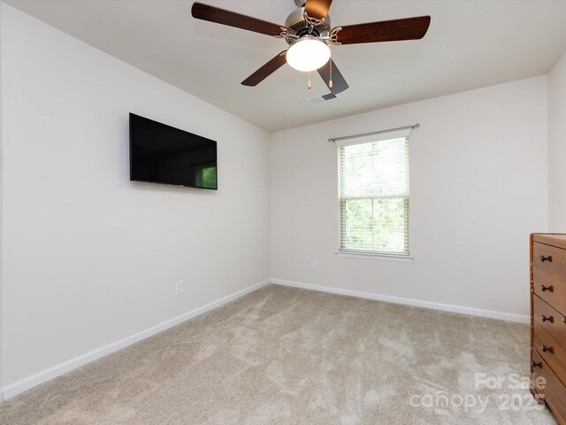 403 Park Meadows Dr, Matthews, NC 28104 - unfurnished bedroom with light colored carpet, baseboards, and ceiling fan