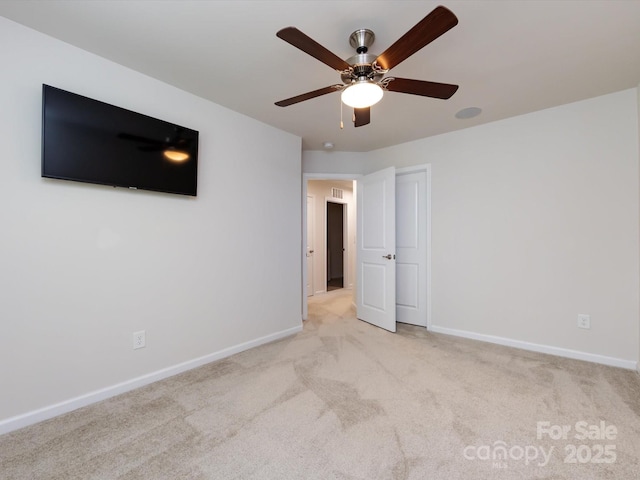 403 Park Meadows Dr, Matthews, NC 28104 - unfurnished bedroom with light colored carpet, baseboards, and a ceiling fan