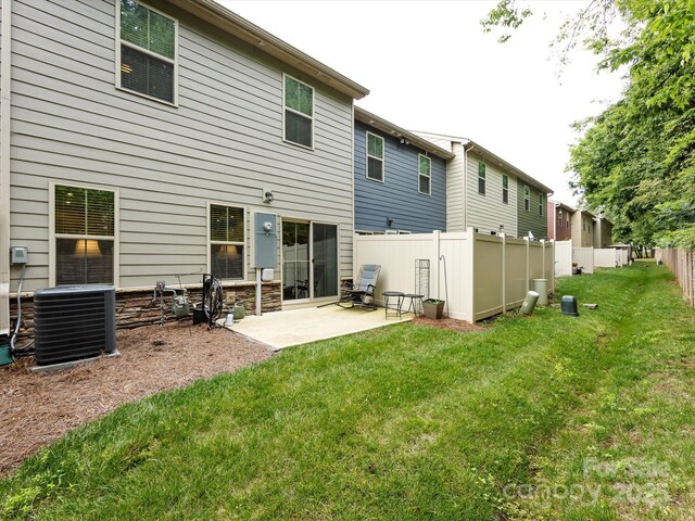 403 Park Meadows Dr, Matthews, NC 28104 - back of house featuring central AC and a patio