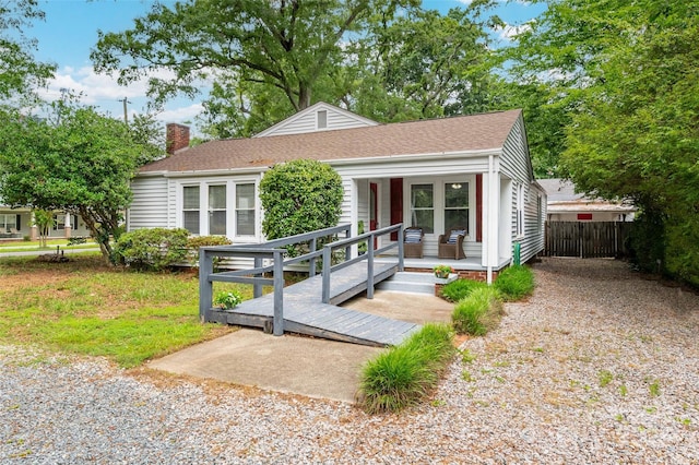 34 Admiral Ave SW, Concord, NC 28027 - view of front of property featuring a chimney, covered porch, and roof with shingles