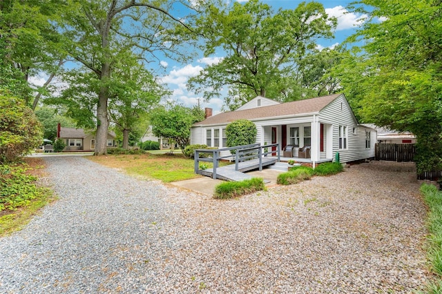 34 Admiral Ave SW, Concord, NC 28027 - view of front of property featuring gravel driveway, a chimney, and a shingled roof