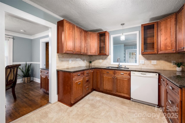 34 Admiral Ave SW, Concord, NC 28027 - kitchen featuring dishwasher, a sink, brown cabinetry, a textured ceiling, and ornamental molding