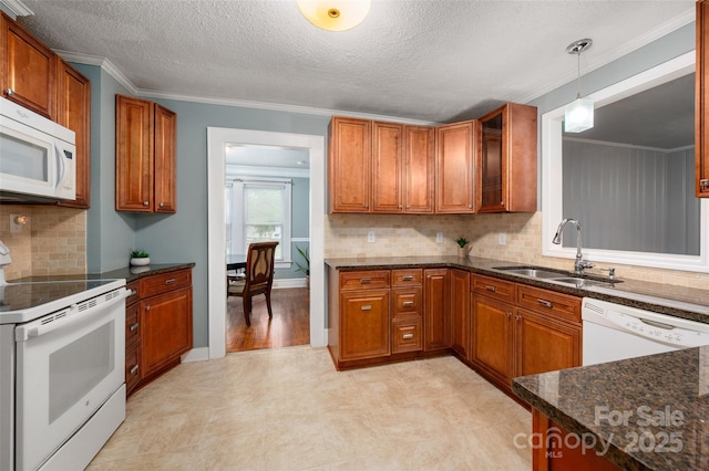 34 Admiral Ave SW, Concord, NC 28027 - kitchen featuring white appliances, a sink, brown cabinetry, backsplash, and ornamental molding